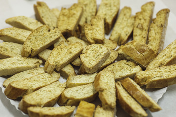 Crackers on a baking sheet. Production of tasty pastries