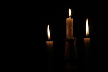 three candles in the dark