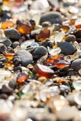 Piles of sea glass on a pacific beach