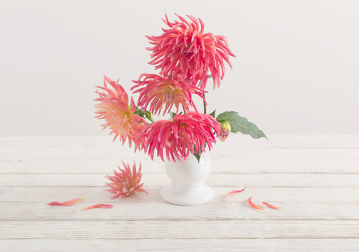 Dahlia Flowers In White Vase On Wooden Table