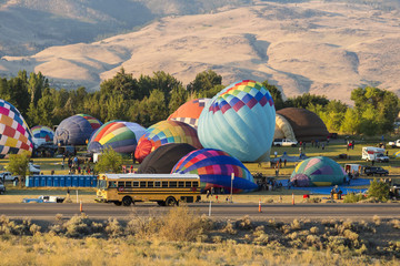 Hot air balloons taking off in a beautiful blue clear sky
