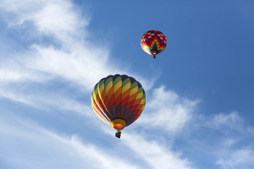 Hot air balloons flying in a beautiful blue clear sky