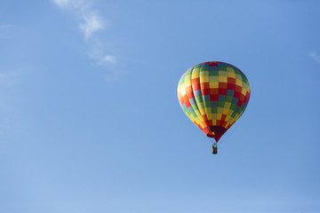 Fototapeta na wymiar Hot air balloons flying in a beautiful blue clear sky