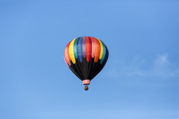 Hot air balloons flying in a beautiful blue clear sky
