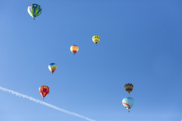 Hot air balloons flying in a beautiful blue clear sky