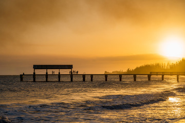 Fototapeta premium Waimea sunset turn bright yellow by smoke from nearby wildfires
