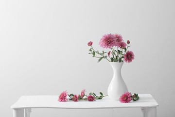 still life with chrysanthemums on white background