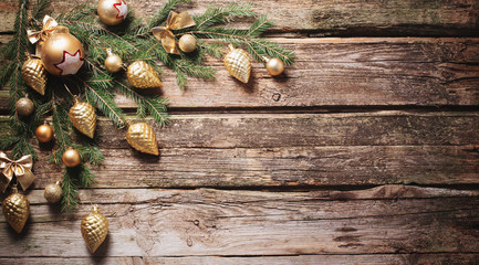 golden christmas decoration on old wooden background