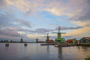 Fototapeta na wymiar De Gekroonde Poelenburg, De Kat, Windmill De Zoeker, Houtzaagmolen het Jonge Schaap windmill and river sunset view
