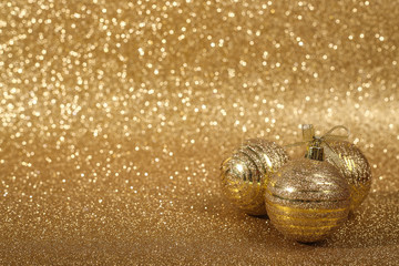 Christmas balls on gold glitters