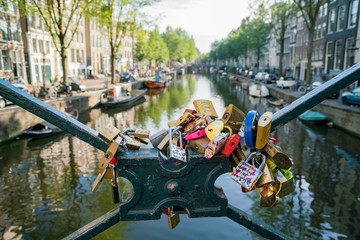 Many locks on the bridge over a canal