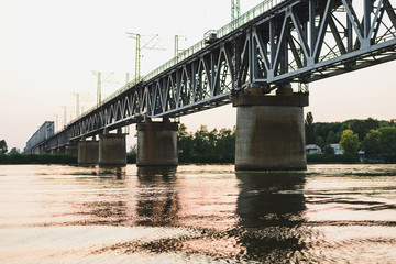 bridge over the river at sunset