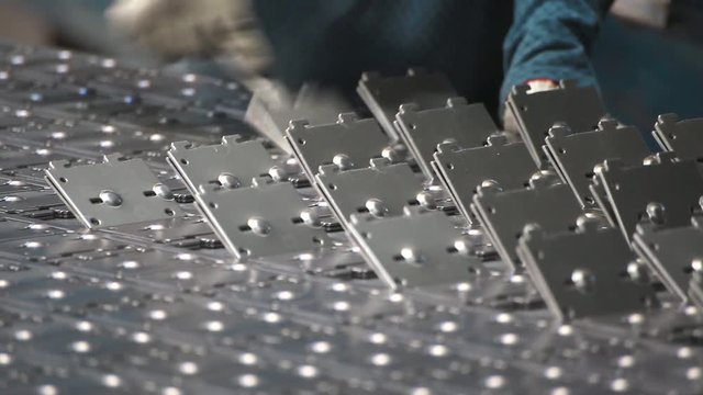 worker pulls the workpiece at the factory. Steel billets are picked out of the mold. .steel metal production machine at factory closeup