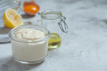Homemade mayonnaise sauce and olive oil, eggs, mustard, lemon