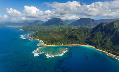 View of the beaches and mountains of Kauai's north coast with Tunnels Beach and the reef from Haena...