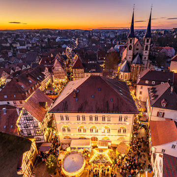 Panoramic view of the german city of Bad Wimpfen with traditional christmas market and the city church during the blue hour. HDR taken from the blue tower (Blauer Turm).