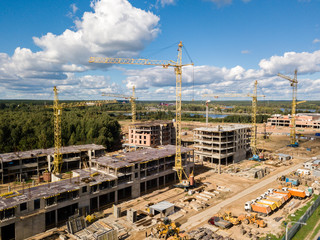 Construction site with crane and building. Aerial drone view