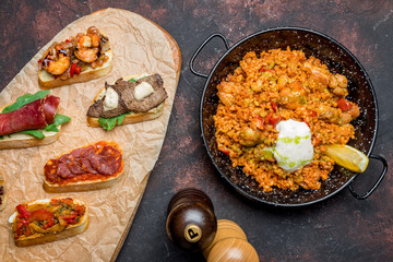assorted bruschett on the Board and spanish paella