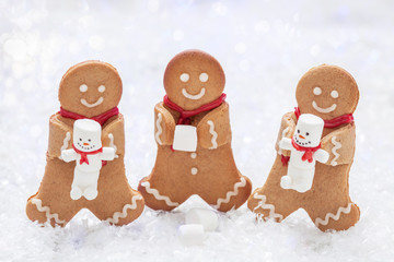 Funny Gingerbread cookie men with cute marshmallow snowman