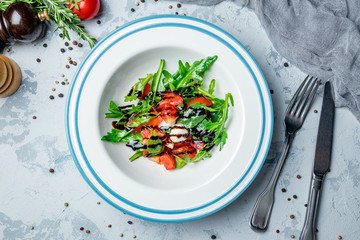 Salad with tomato arugula and mozarella cheese