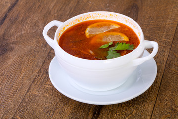 Solyanka soup with lemon