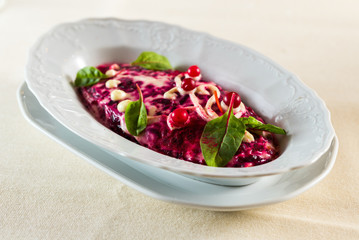 herring with red beets and cold sauce mayonnaise prepared from vegetable oil, egg yolk salad fur coat national festive meal