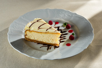 Fresh cheesecake with berries and dipping on a plate