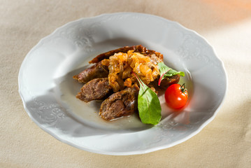 homemade smoked hot pork sausage with vegetables and fried onions