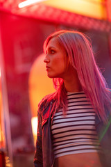 Cinematic portrait of girl with pink hair and neon lights