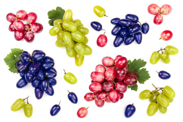 green pink and blue grapes with leaves isolated on the white background