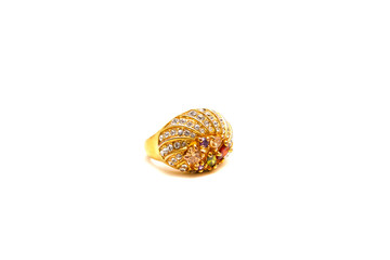 Gold ring with precious stones on white isolated background