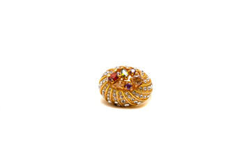 Gold ring with precious stones on white isolated background