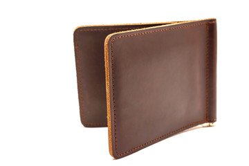 Brown money clip made of leather closed on a white background