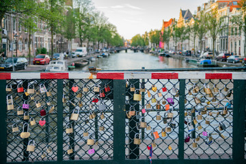 Many locks on the bridge over a canal