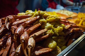 Crab legs sticks on street food market of China at night