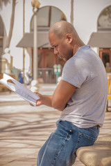 African American black man is reading his script for the audition.