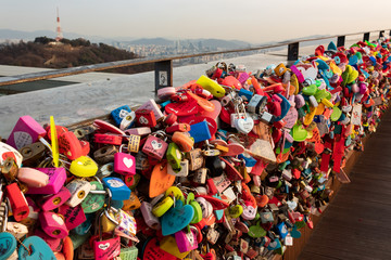 SEOUL, SOUTH KOREA - JAN 22, 2018: Padlocks left from couples that visited the N Seoul Tower at sunset, love concept