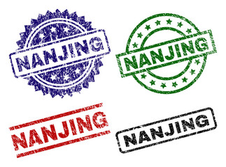 NANJING seal prints with corroded texture. Black, green,red,blue vector rubber prints of NANJING title with corroded surface. Rubber seals with circle, rectangle, medallion shapes.