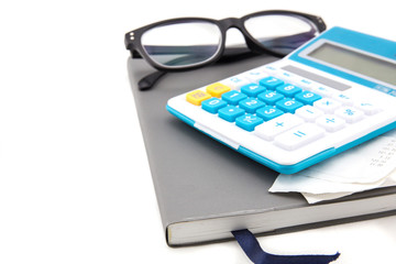 Receipt or bill from shop on gray calculator