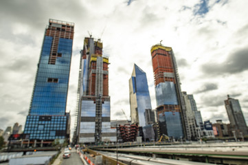 Blurred skyscrapers in construction. View from elevated High Line in Manhattan, New York, USA..