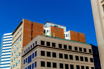 Old and new houses with huge windows in Montreal downtown, Canada.