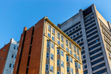 Old and new houses with huge windows in Montreal downtown, Canada.