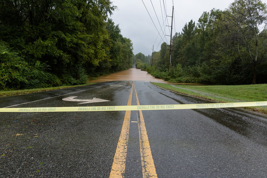 Waxhaw, North Carolina - September 16, 2018: Rainwater from Hurricane Florence floods a roadway