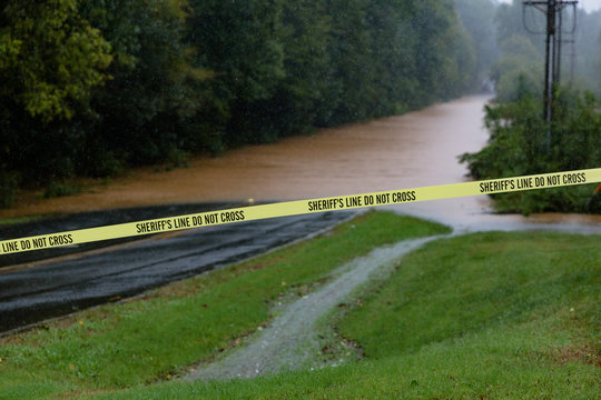 Waxhaw, North Carolina - September 16, 2018: Rainwater from Hurricane Florence floods a roadway