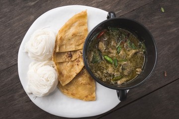 Beef green curry with naan and rice noodles