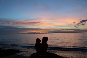 Mother and Child enjoying un-edited sunset at Red Rocks, Phillip Island, Australia