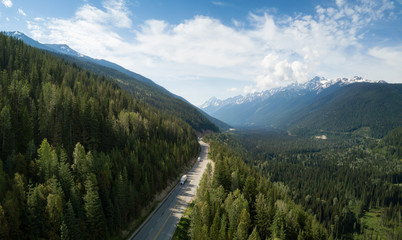 Fototapeta na wymiar Aerial view of Trans-Canada Highway in the Canadian Mountain Landscape. Located between Golden and Revelstoke, BC, Canada.