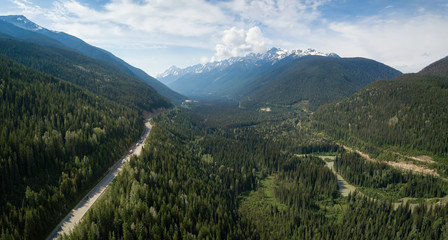 Fototapeta premium Aerial view of Trans-Canada Highway in the Canadian Mountain Landscape. Located between Golden and Revelstoke, BC, Canada.