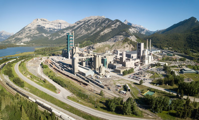 Fototapeta na wymiar Aerial view of an industrial site in the Canadian Rockies during a vibrant sunny summer day. Taken near Calgary, Alberta, Canada.