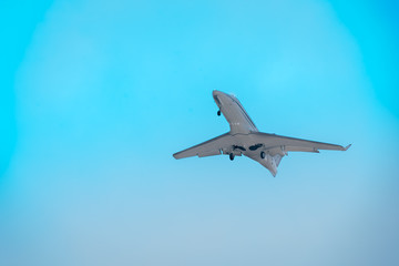 Airplane flying high departing from the airport